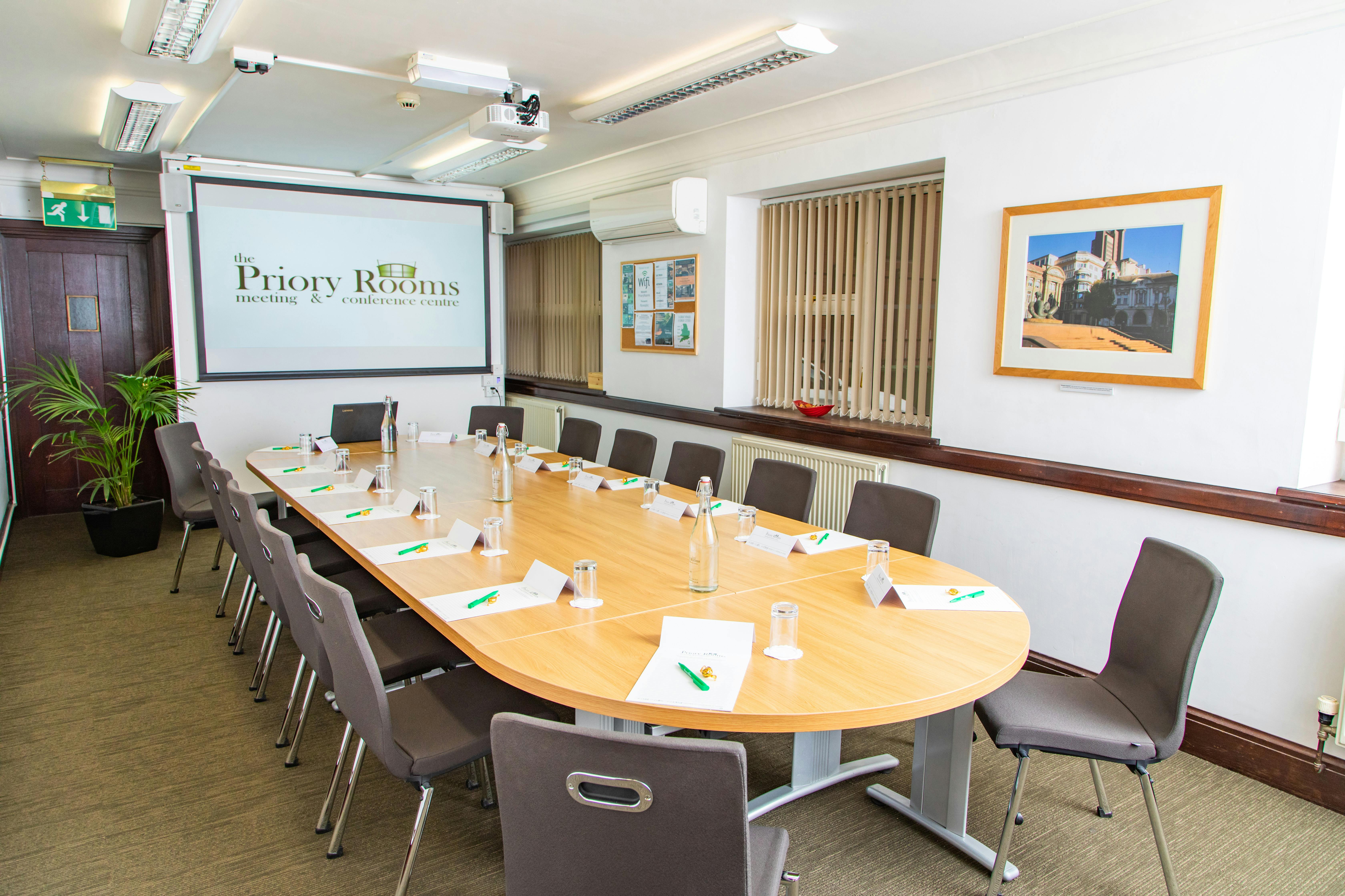 Lloyd room at The Priory Rooms, oval table setup for professional meetings and conferences.