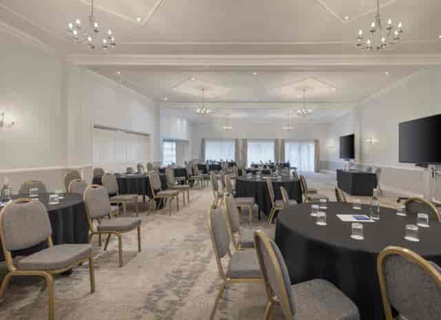 Broughton Suite meeting space with round tables, ideal for workshops and presentations.