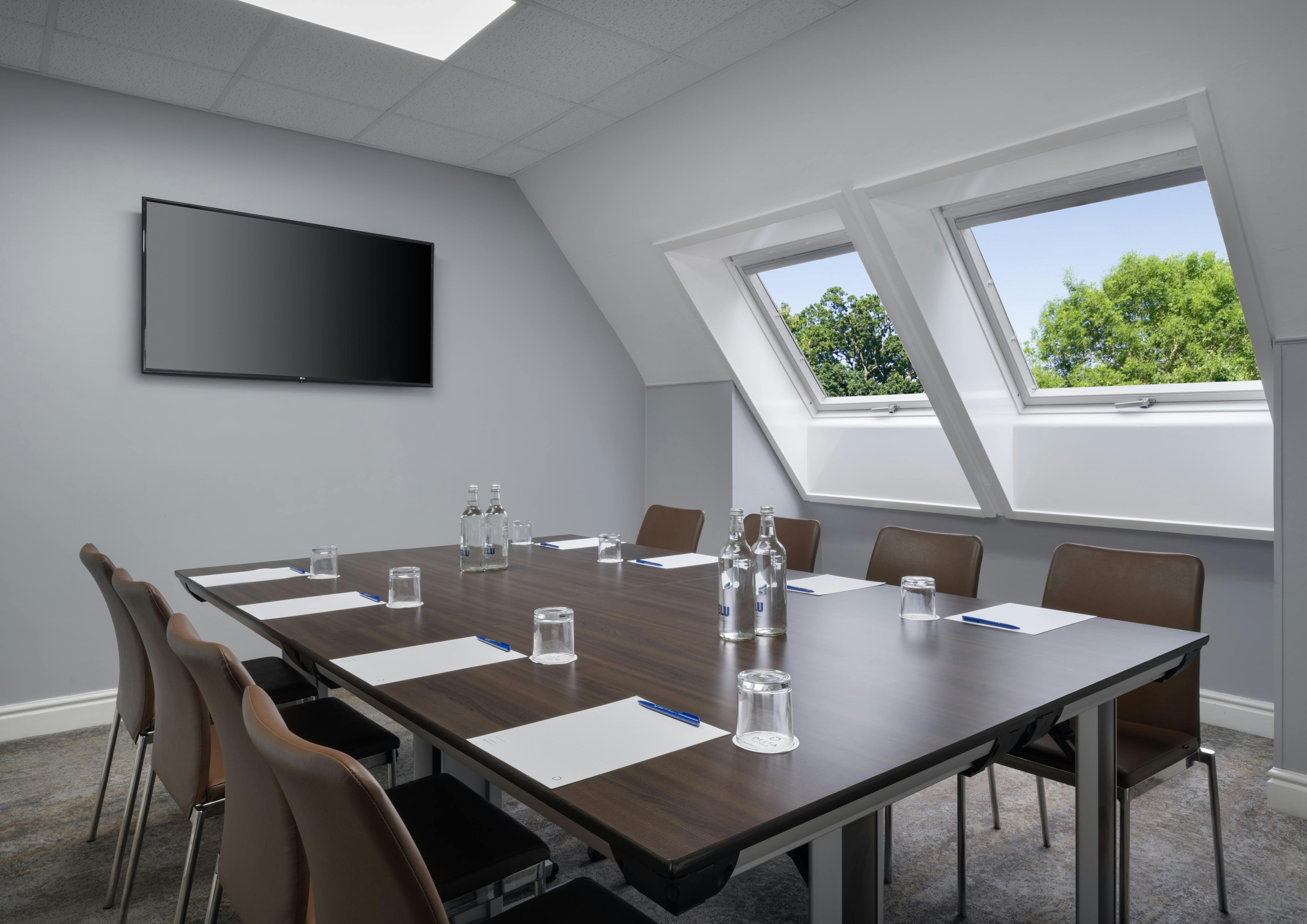 Modern meeting room at Delta Hotels Preston with large table for productive events.