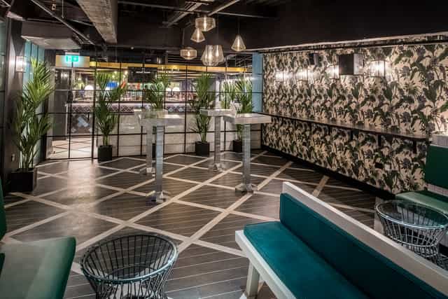 Stylish Palm Lounge at Swingers West End, perfect for networking and social events.