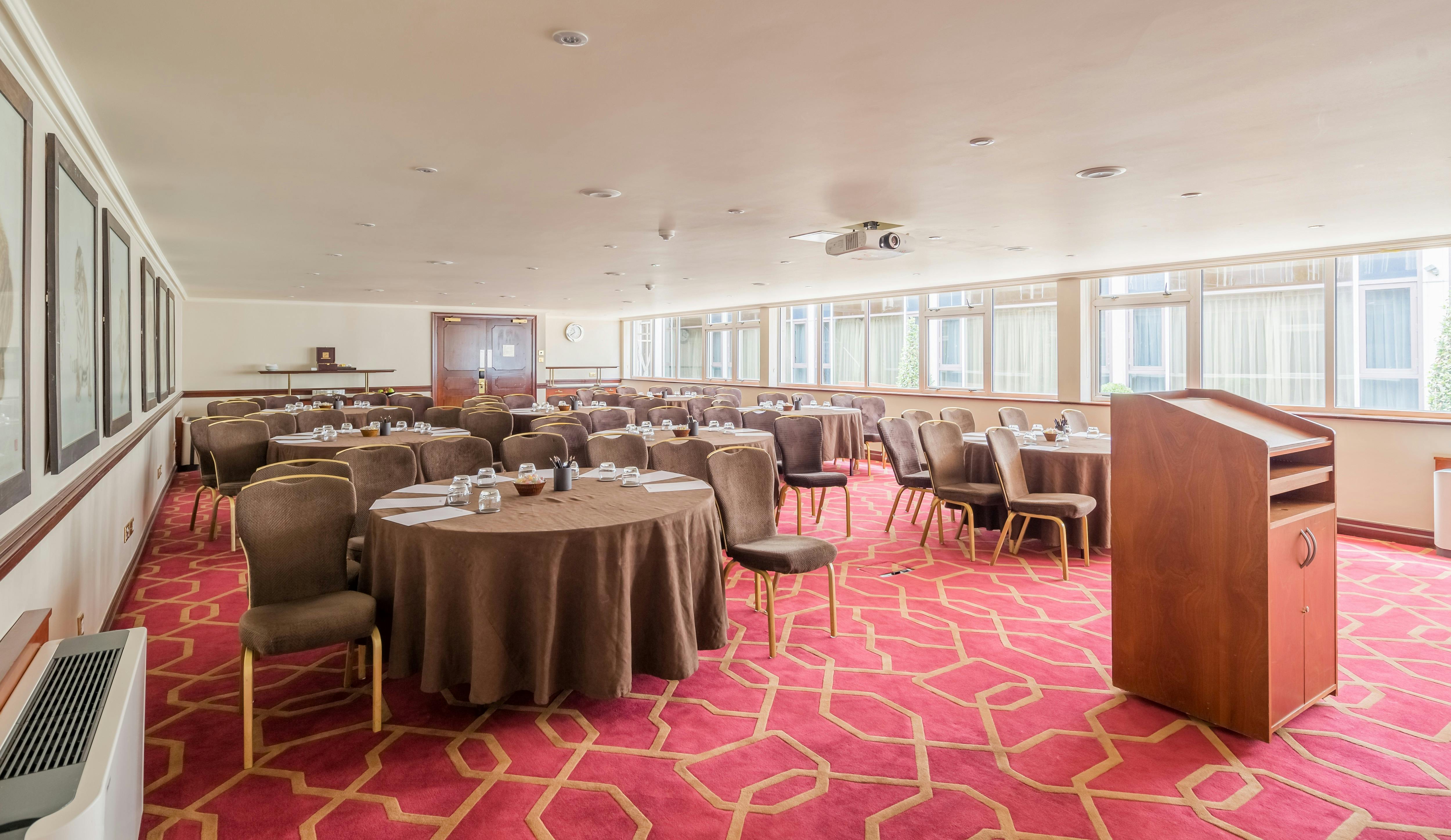 Private Room 11 at Radisson Blu Heathrow, ideal for corporate events with round tables.