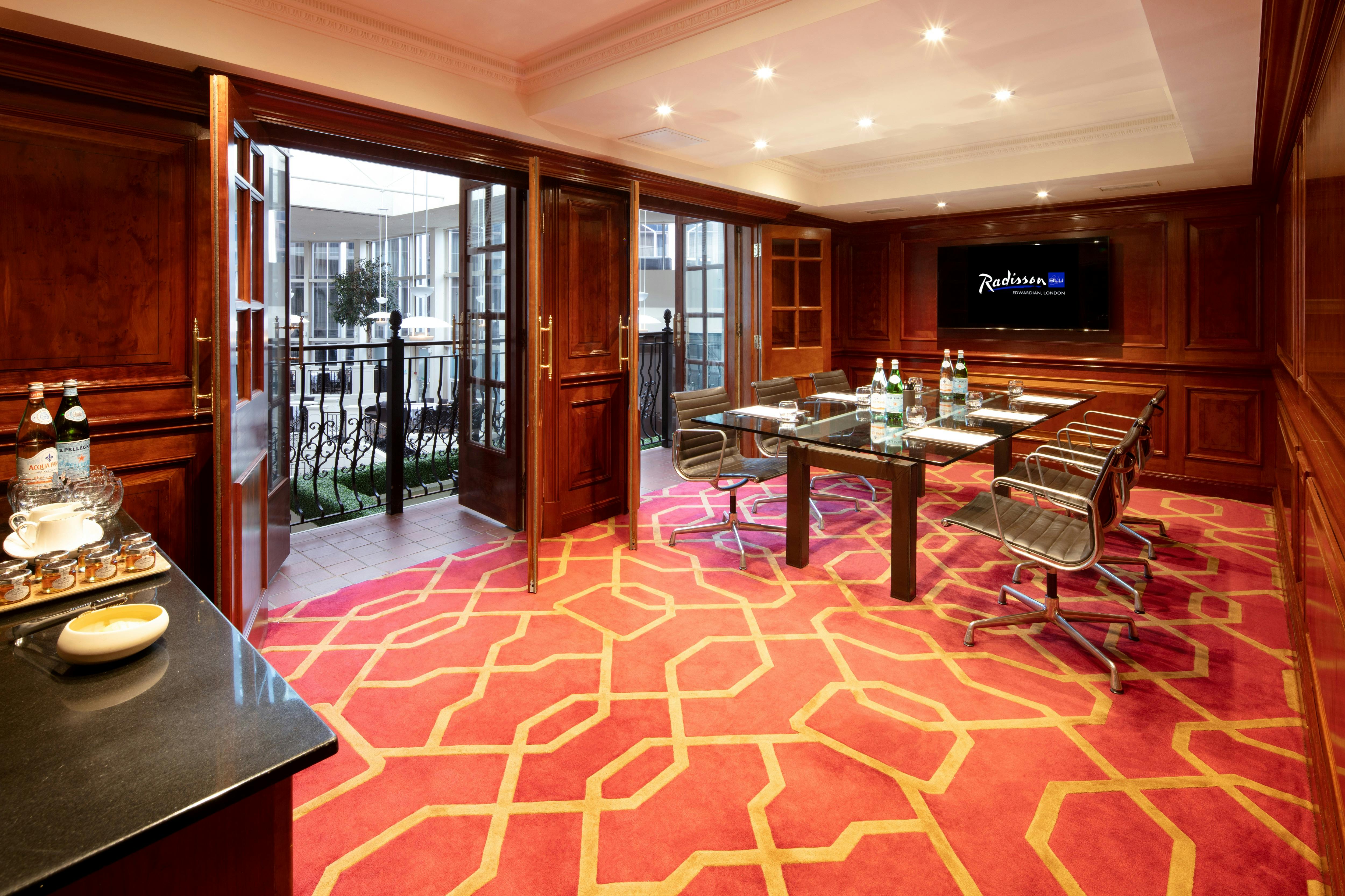 Private Room 30 at Radisson Blu Heathrow, elegant meeting space with natural light.