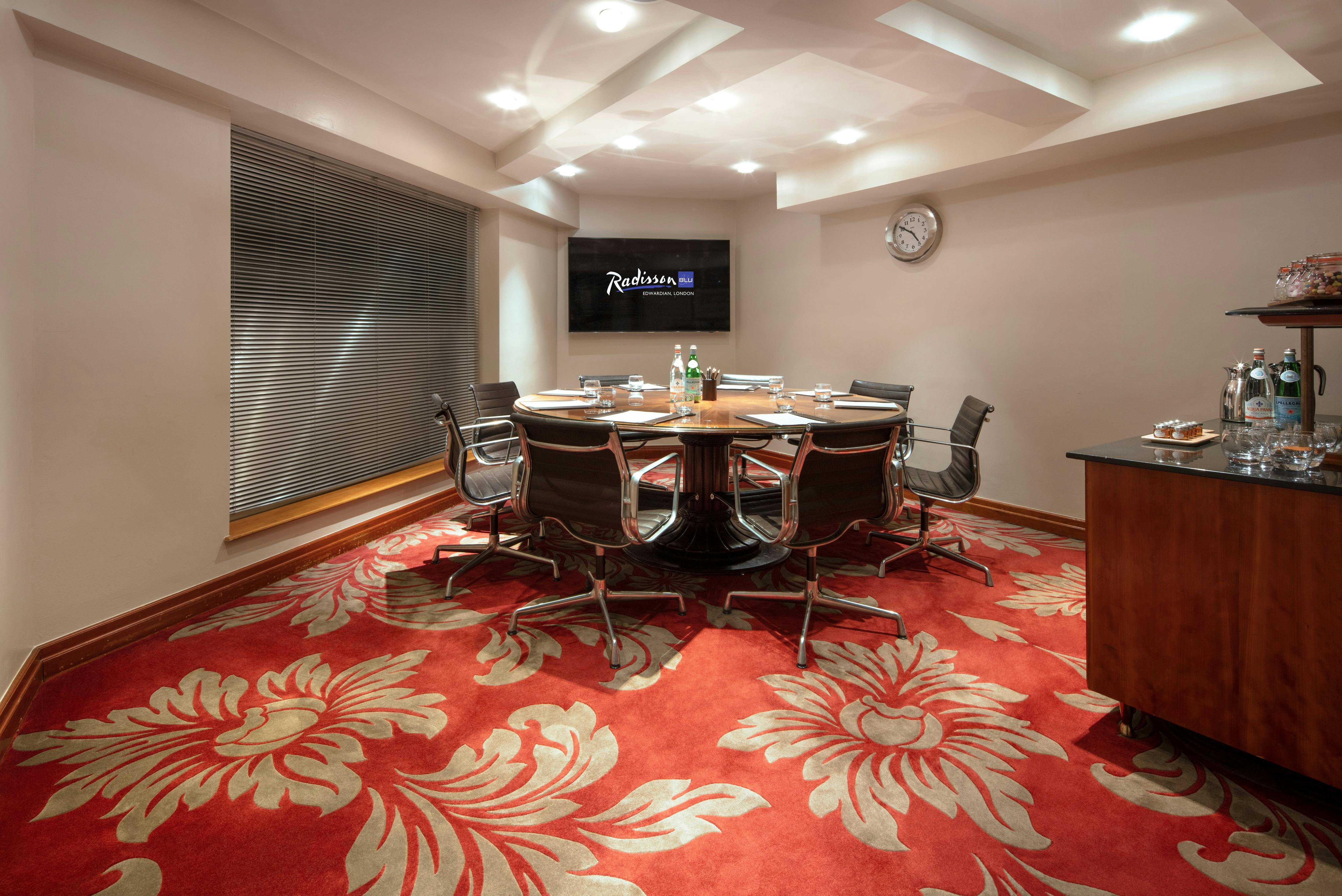 Private Room 37 at Radisson Blu Heathrow, featuring a round table for meetings and events.