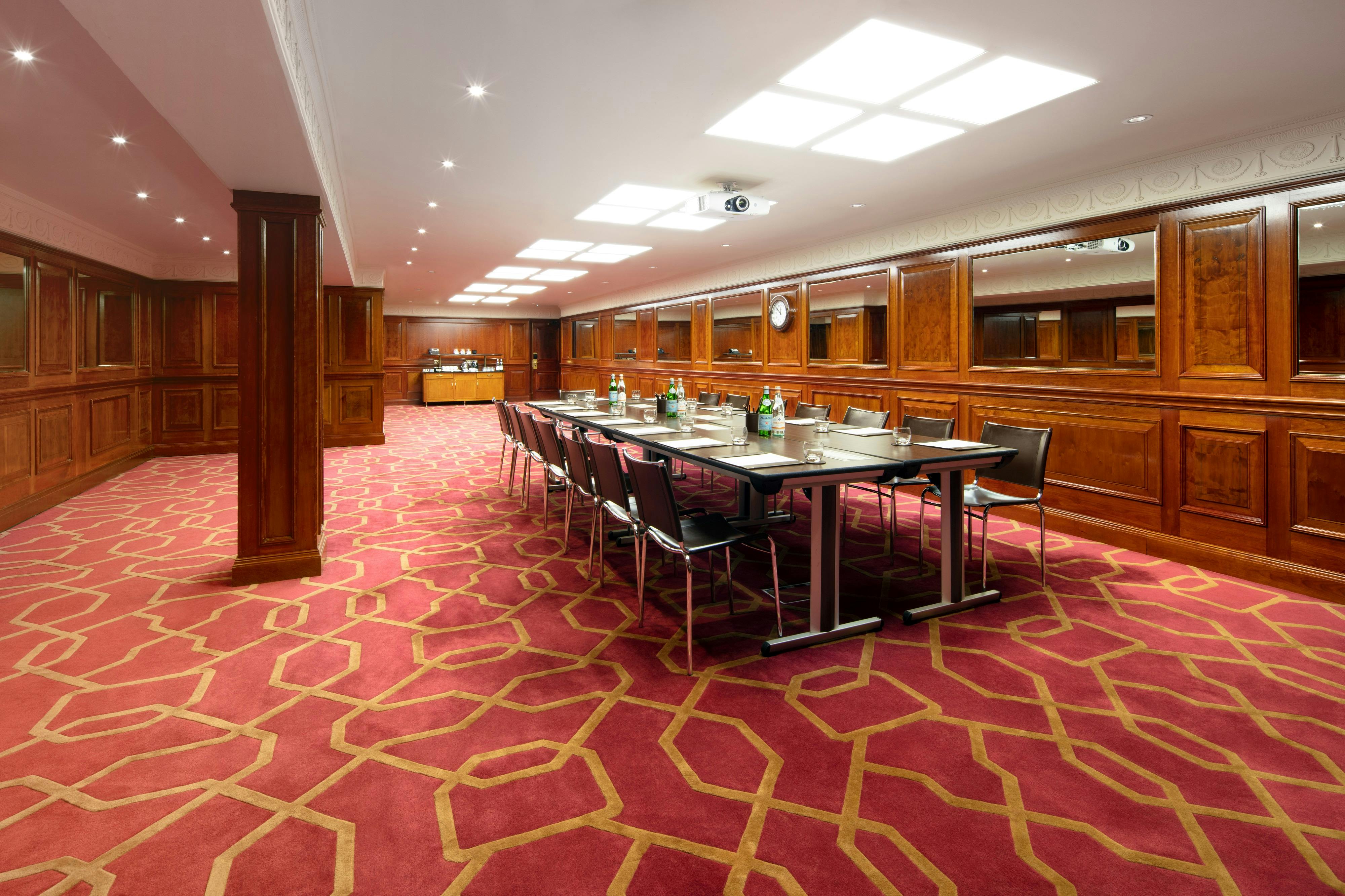 Private Room 41 at Radisson Blu Heathrow, featuring a long conference table for meetings.