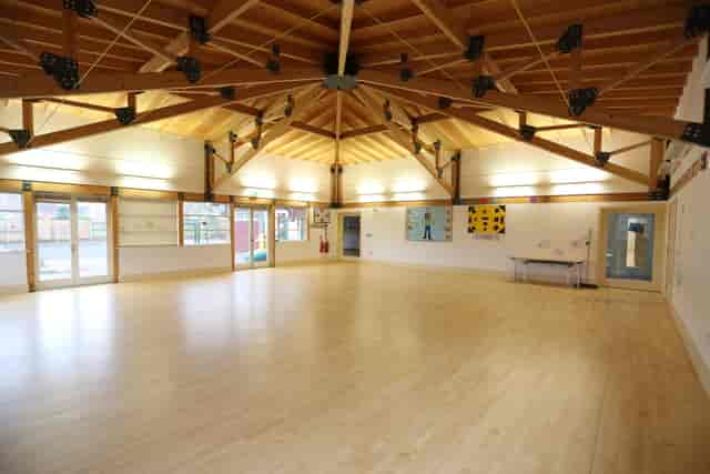 Kingspan Hall in Gamlingay Eco Hub: spacious venue with high ceiling for workshops and events.