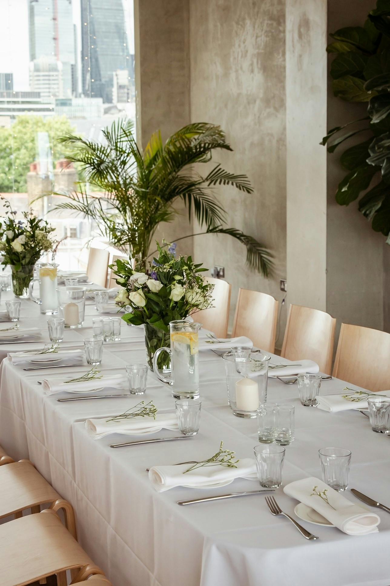 Elegant dining setup in Menier Penthouse for formal events and celebrations.