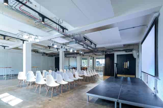 Industrial-chic theater presentation stage at The White Space, The Ministry event venue.