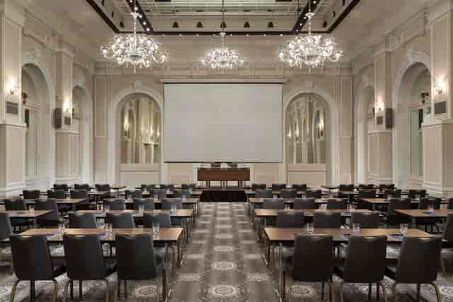 Conference room at Baccarat, Hilton Paris Opera with elegant chandeliers for professional events.