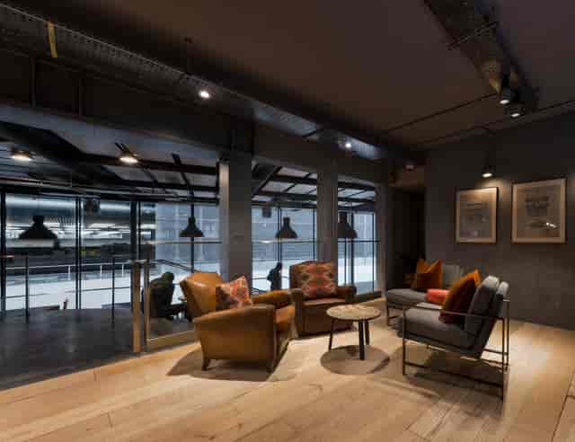 Industrial-chic lounge in City Pavilion for intimate corporate meetings and networking events.