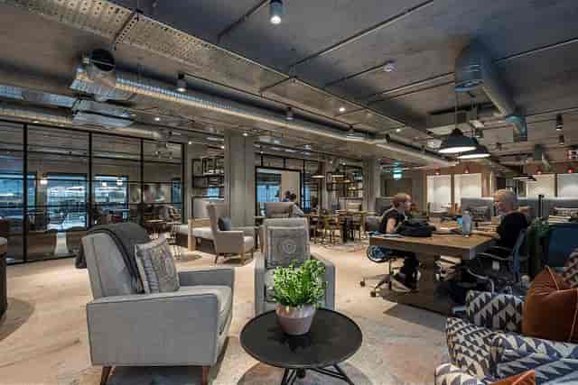 Industrial-chic lounge in City Pavilion for co-working and professional networking events.