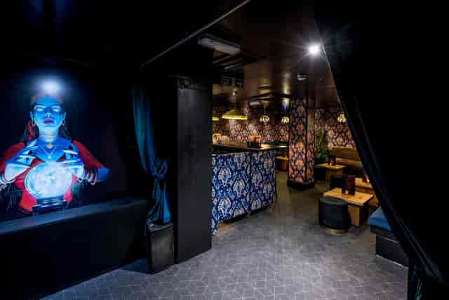 Stylish venue with vibrant mural for intimate gatherings and themed events in Oxford Circus.