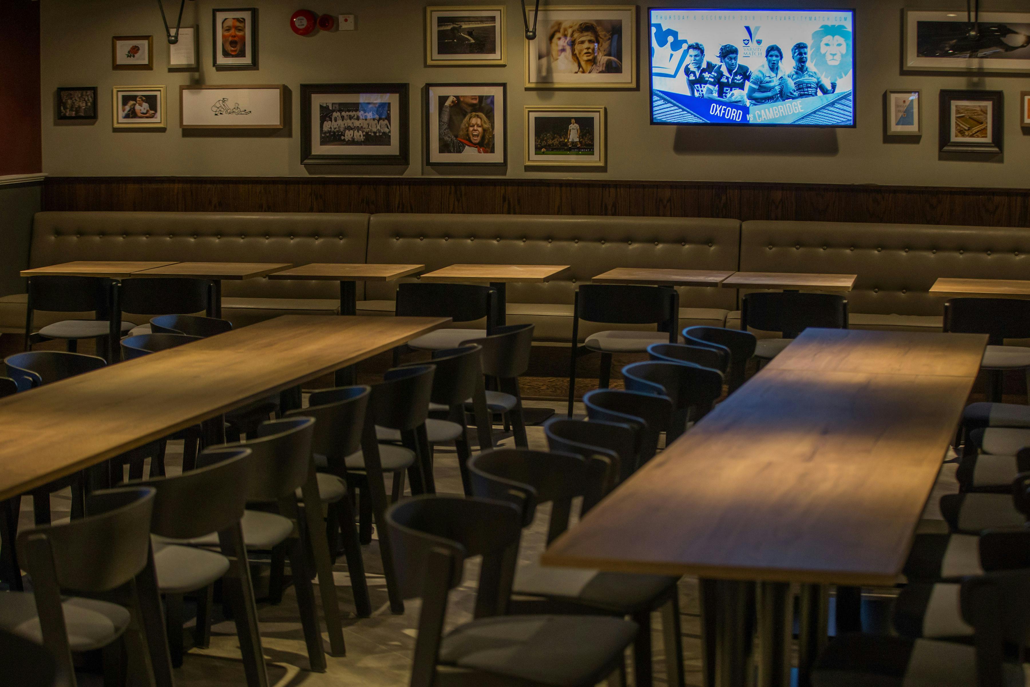 Union Ale House event space with wooden tables, ideal for meetings and gatherings.