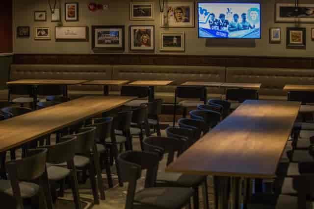Union Ale House event space with wooden tables, ideal for meetings and gatherings.