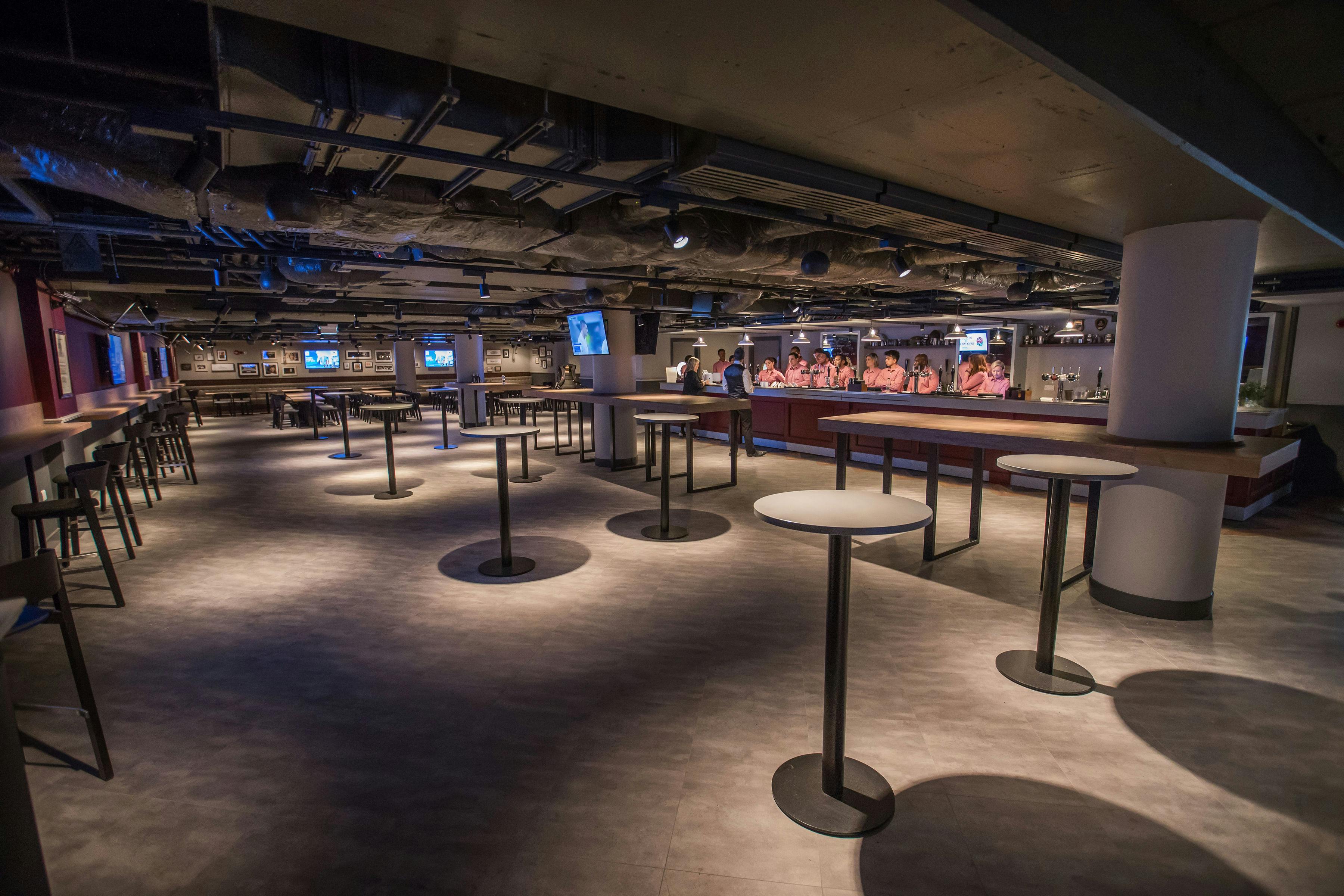 Union Ale House at Allianz Stadium: modern venue with high-top tables for events.