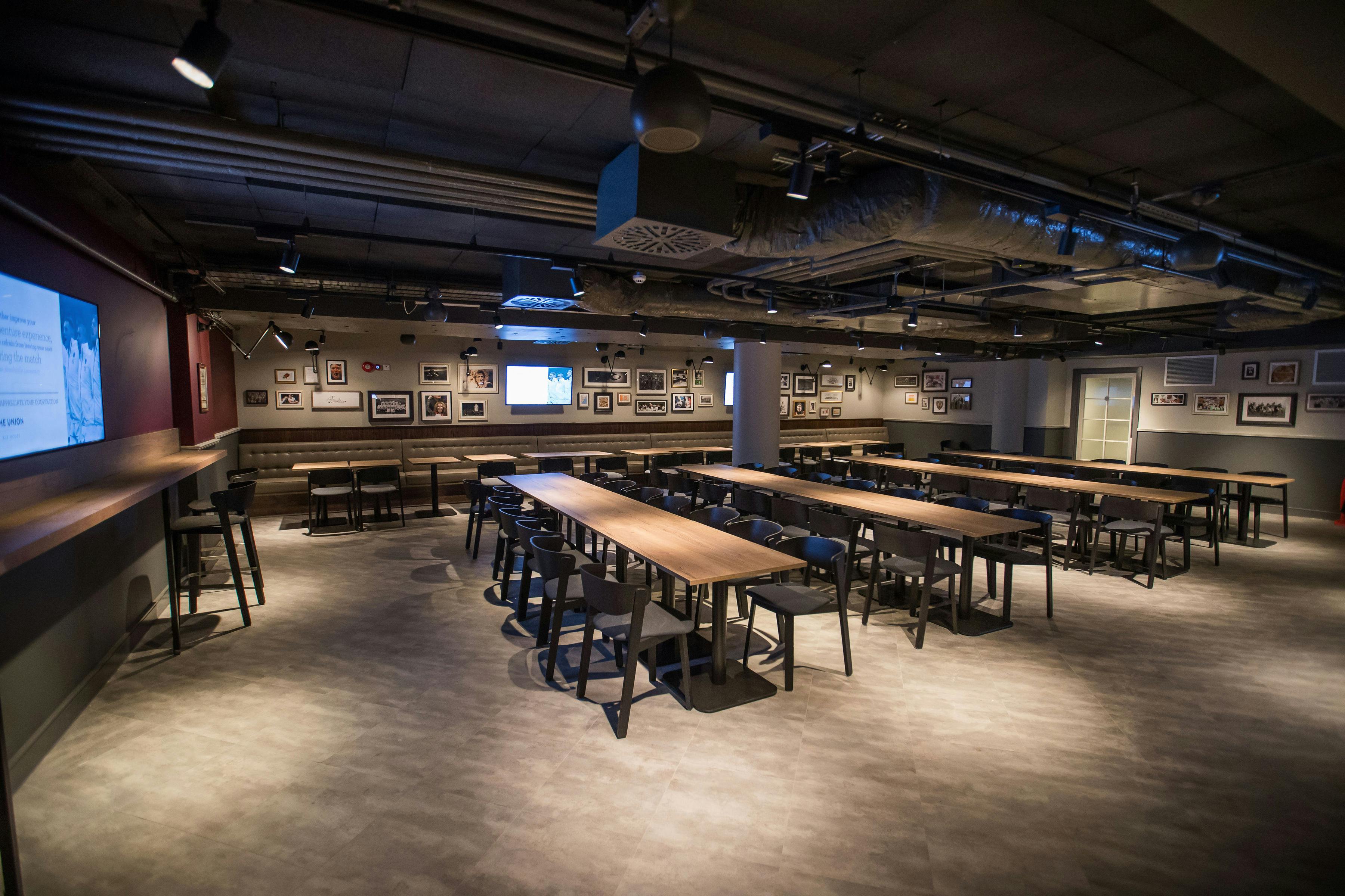 Union Ale House meeting space with long tables, ideal for corporate events and workshops.