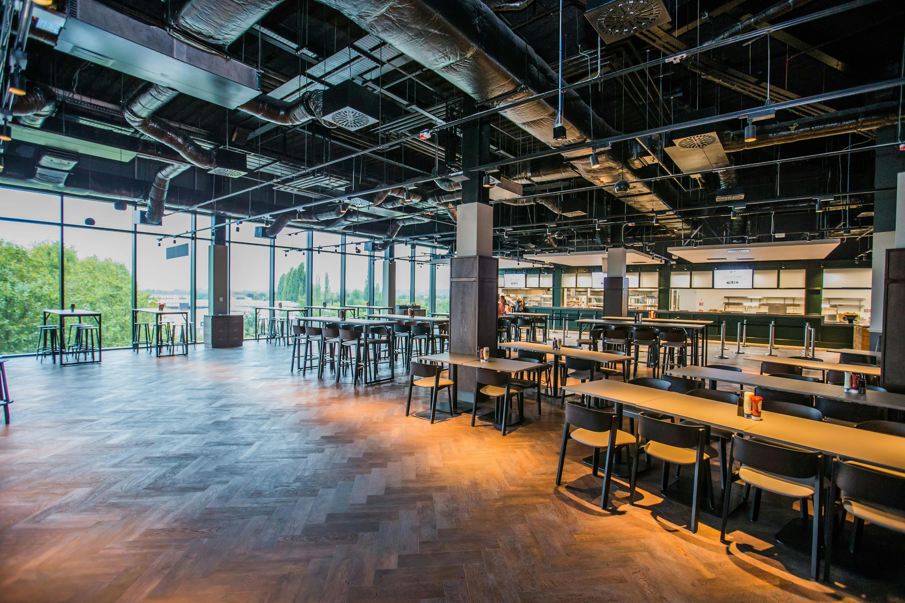 Modern event venue with high ceilings at The Clubhouse Bar & Kitchen, Twickenham.