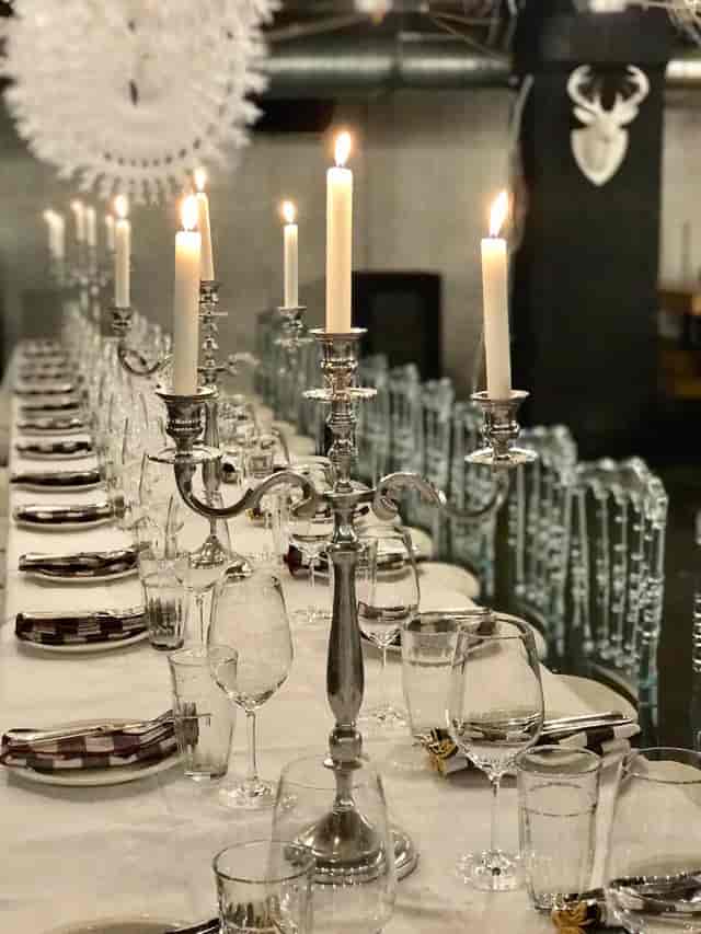 Elegant long dining table with candelabras for formal dinner event in Concrete Space.