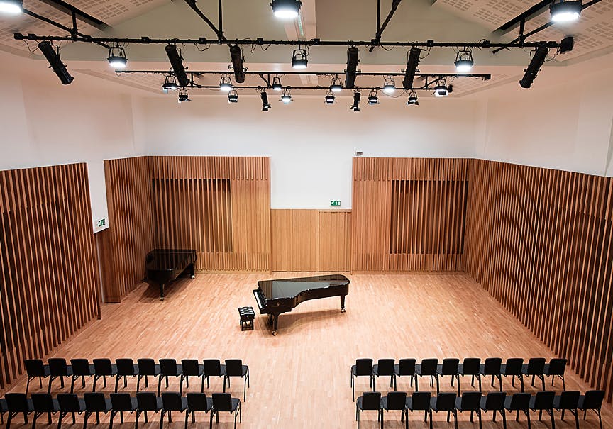 Carole Nash in Chetham's Library auditorium, featuring a grand piano for events.