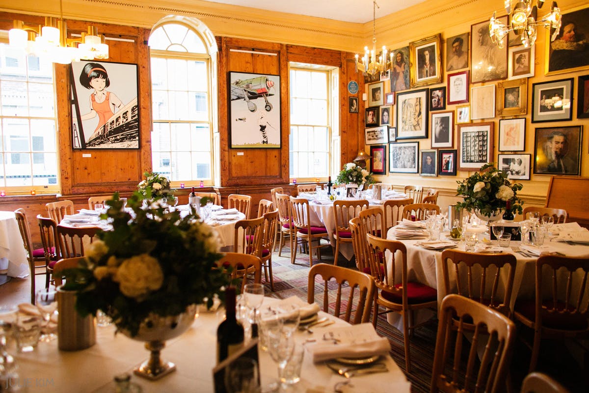 Elegant dining room at The Union Club with floral centerpieces for upscale events.