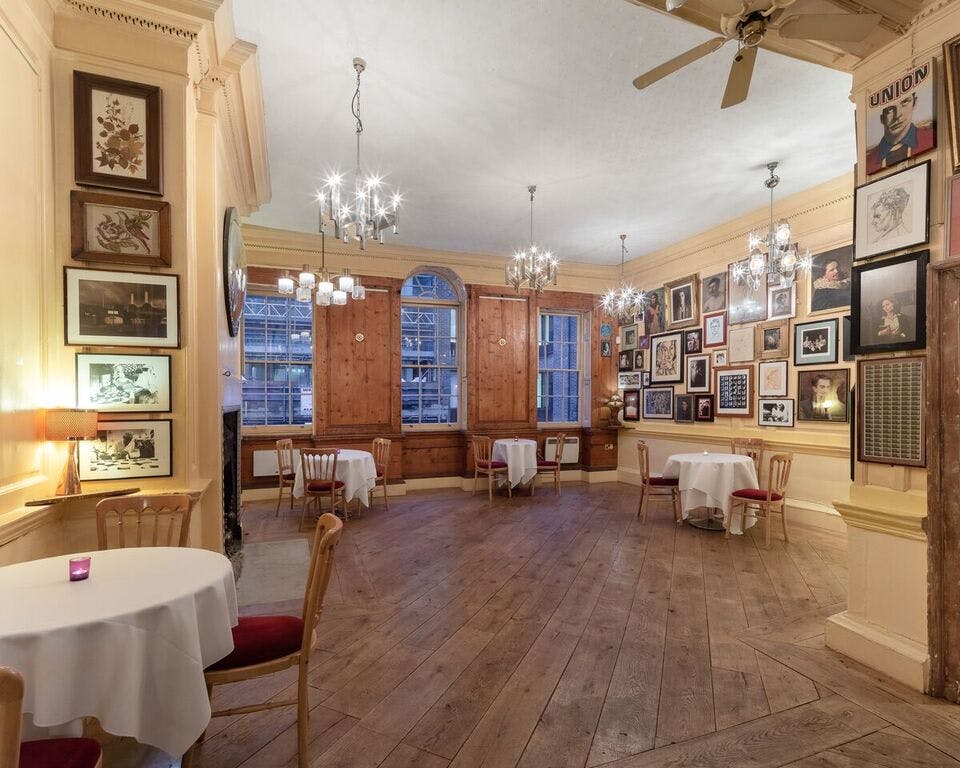 Elegant dining room with chandeliers, perfect for receptions and gatherings.