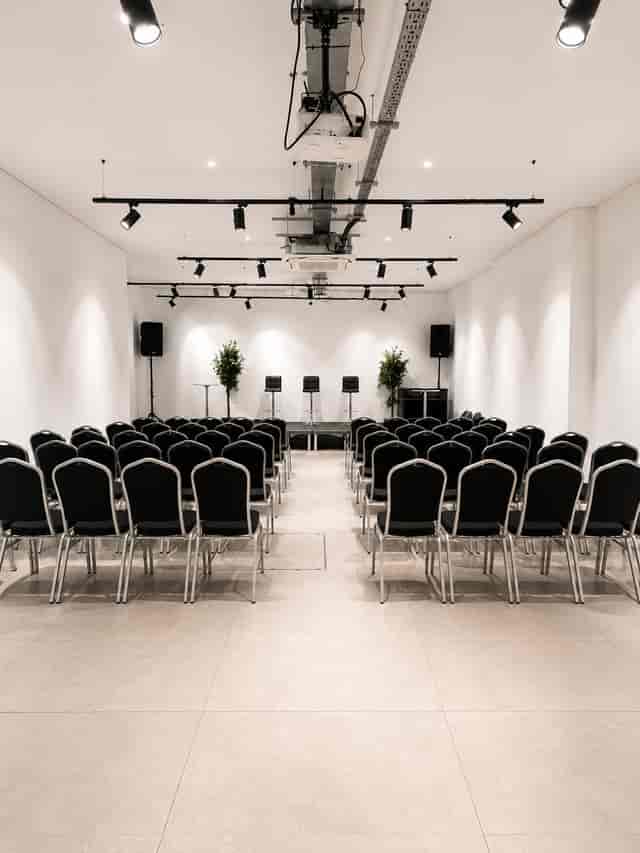 Minimalist theater-style setup at The Old Street Gallery, ideal for panel discussions and events.