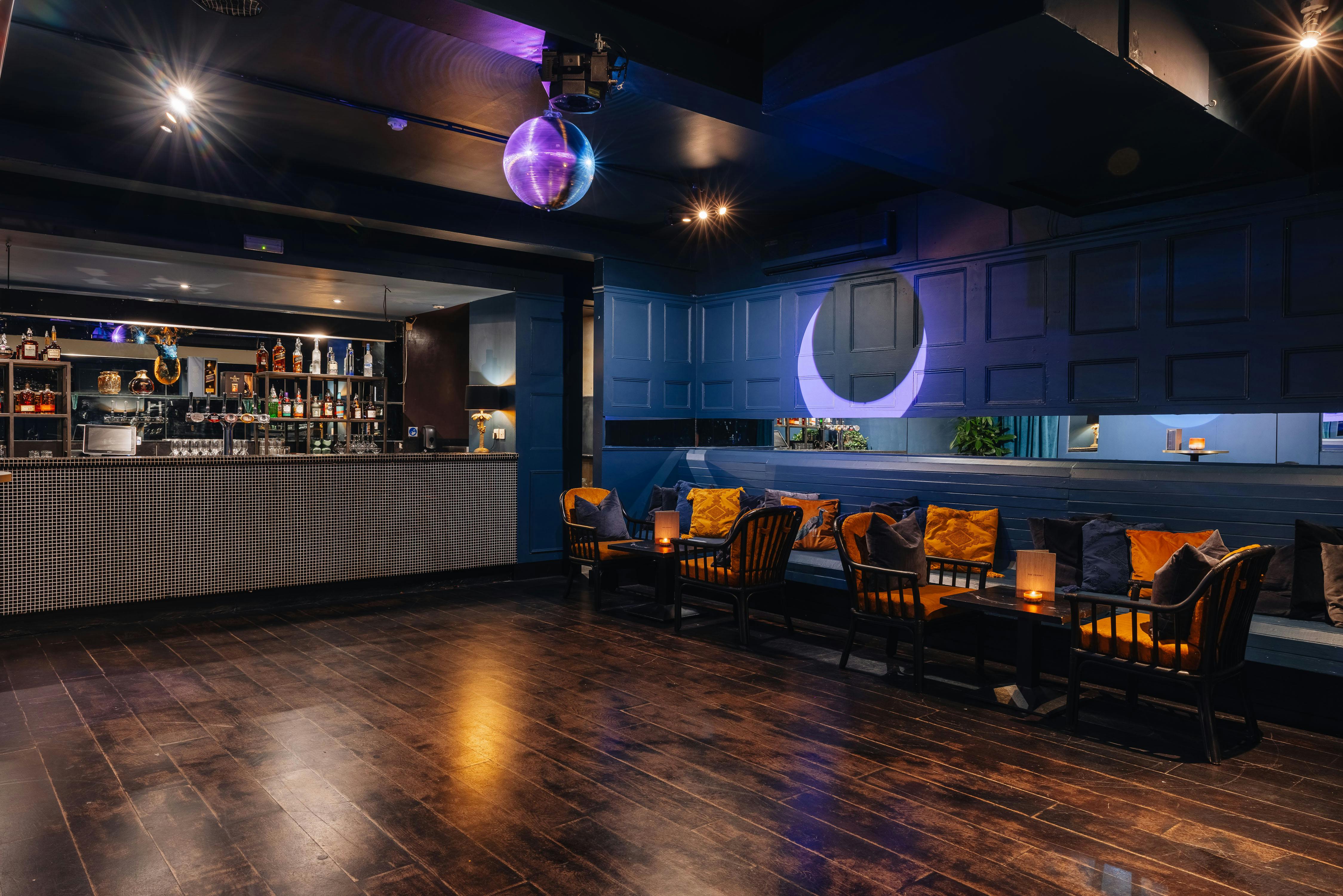 Stylish event space in The Exhibit Balham with sleek bar, ideal for networking and gatherings.