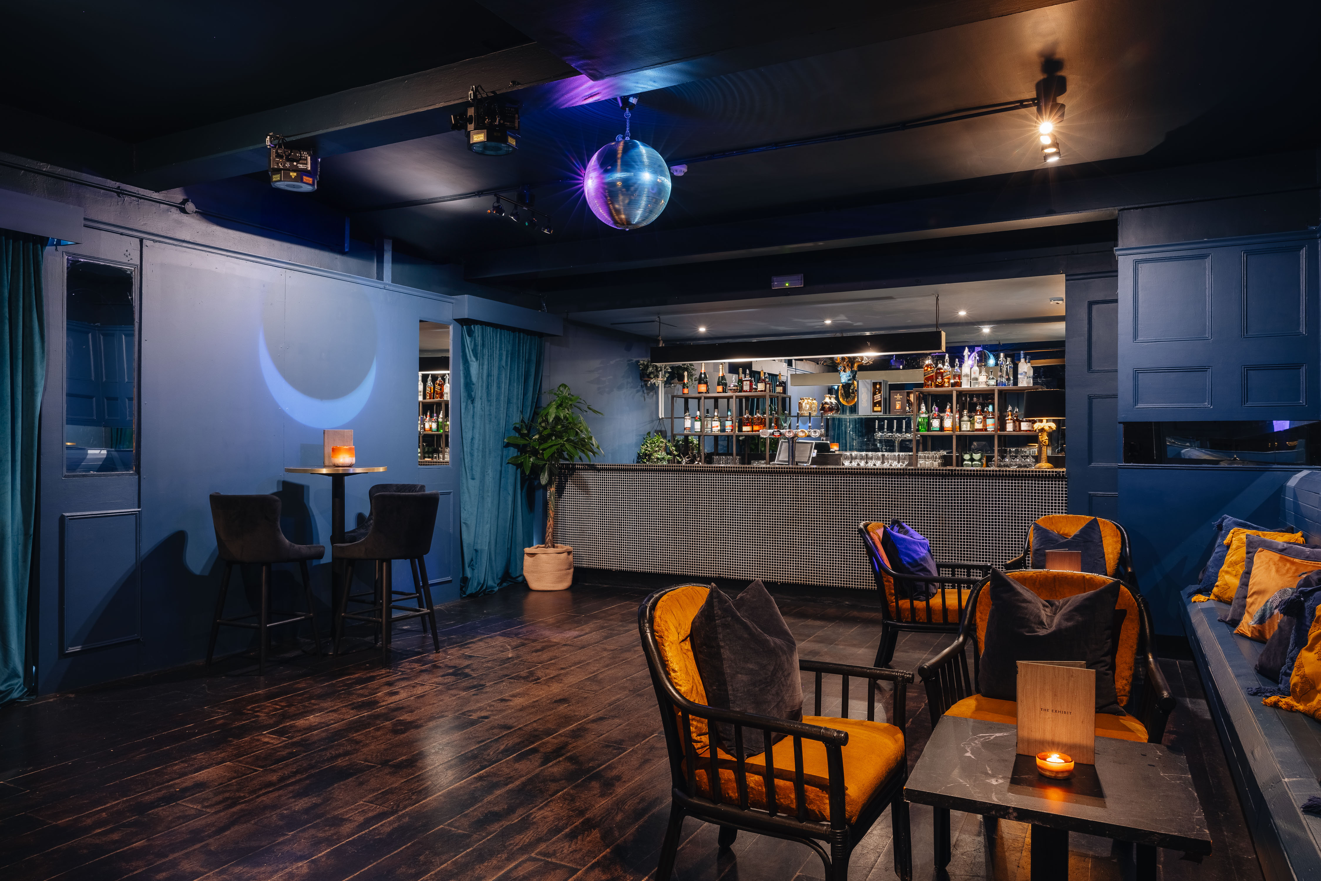 Stylish event space with modern bar and disco ball for gatherings in Balham.