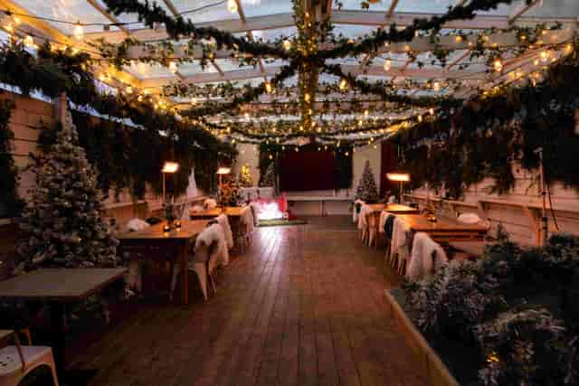 Cozy winter pop-up venue at The Exhibit Balham with festoon lighting for holiday events.