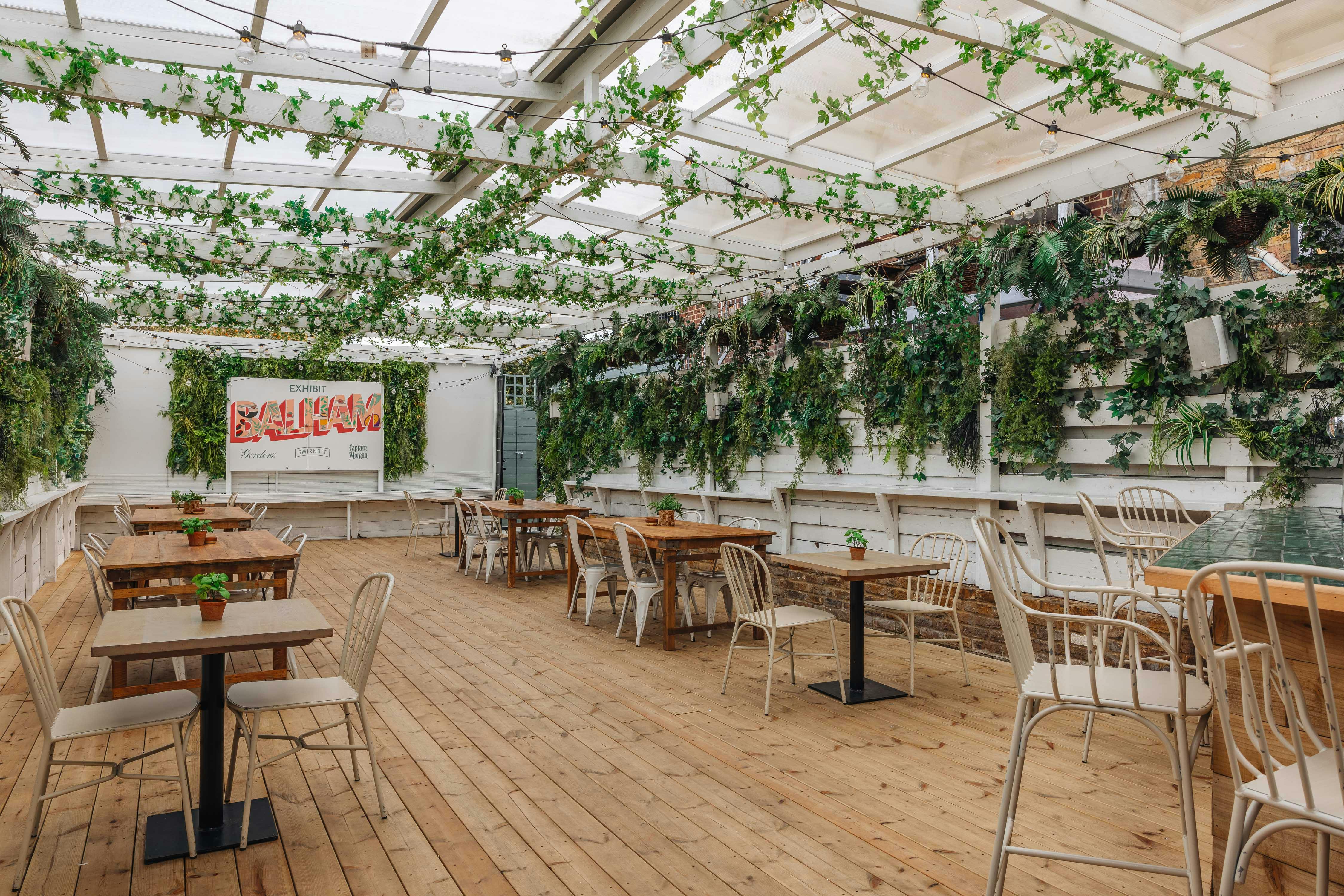 The Secret Garden event space with lush greenery, ideal for workshops and gatherings.