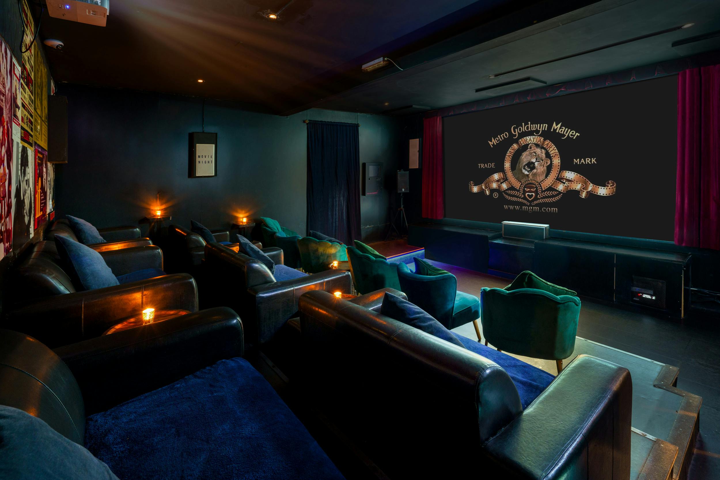 Stylish cinema suite with plush seating for private events and corporate presentations.