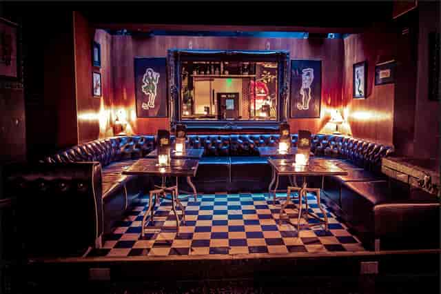 Intimate lounge at The Cocktail Club, plush seating for networking events and gatherings.