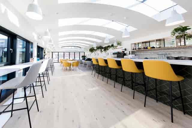 Gallery on 5 breakout area with bar seating for networking events and project meetings.