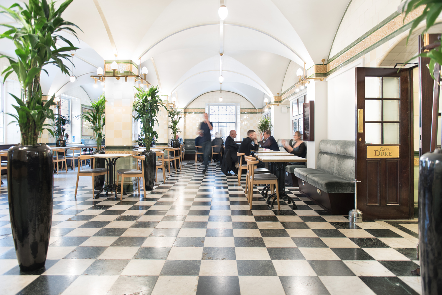 Café Duke at 116 Pall Mall: elegant venue with checkered floor for events and meetings.