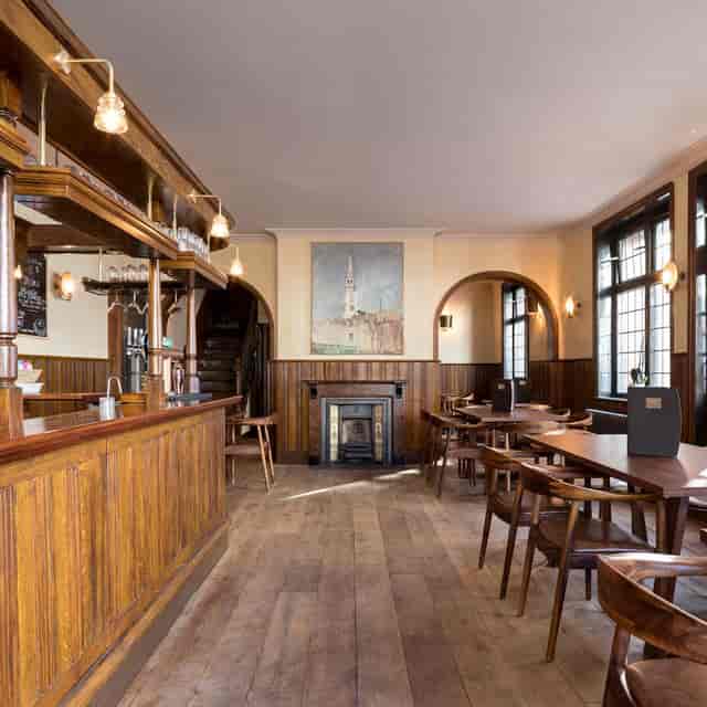 Stylish ballroom with wooden accents, ideal for intimate gatherings and corporate events.