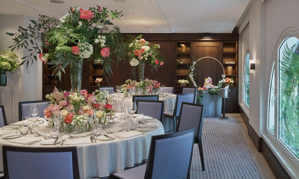 Elegant event space at The Type Room, featuring vibrant floral centerpieces for weddings.
