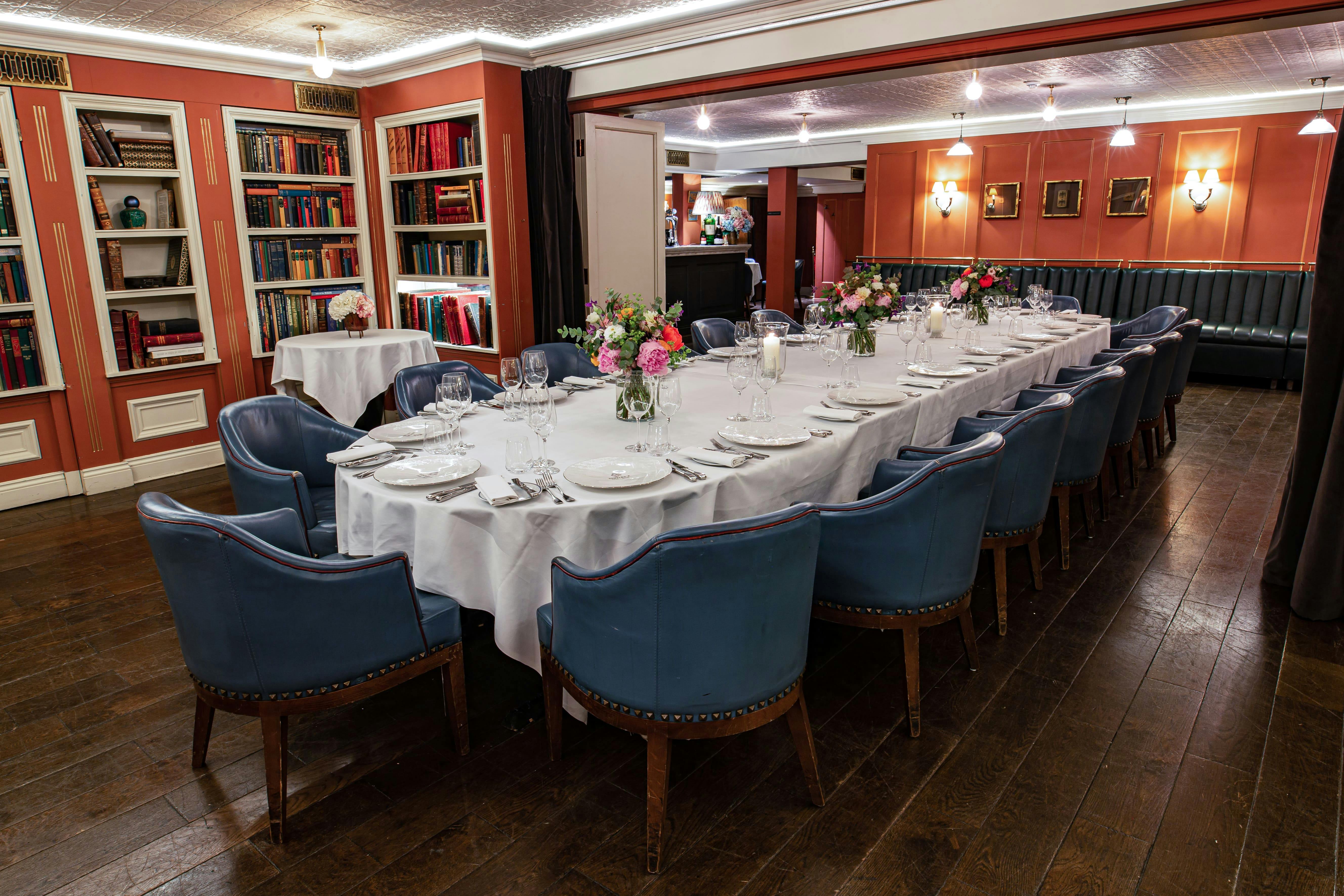 Elegant dining table in Den Room at Bentley's Oyster Bar for intimate gatherings.