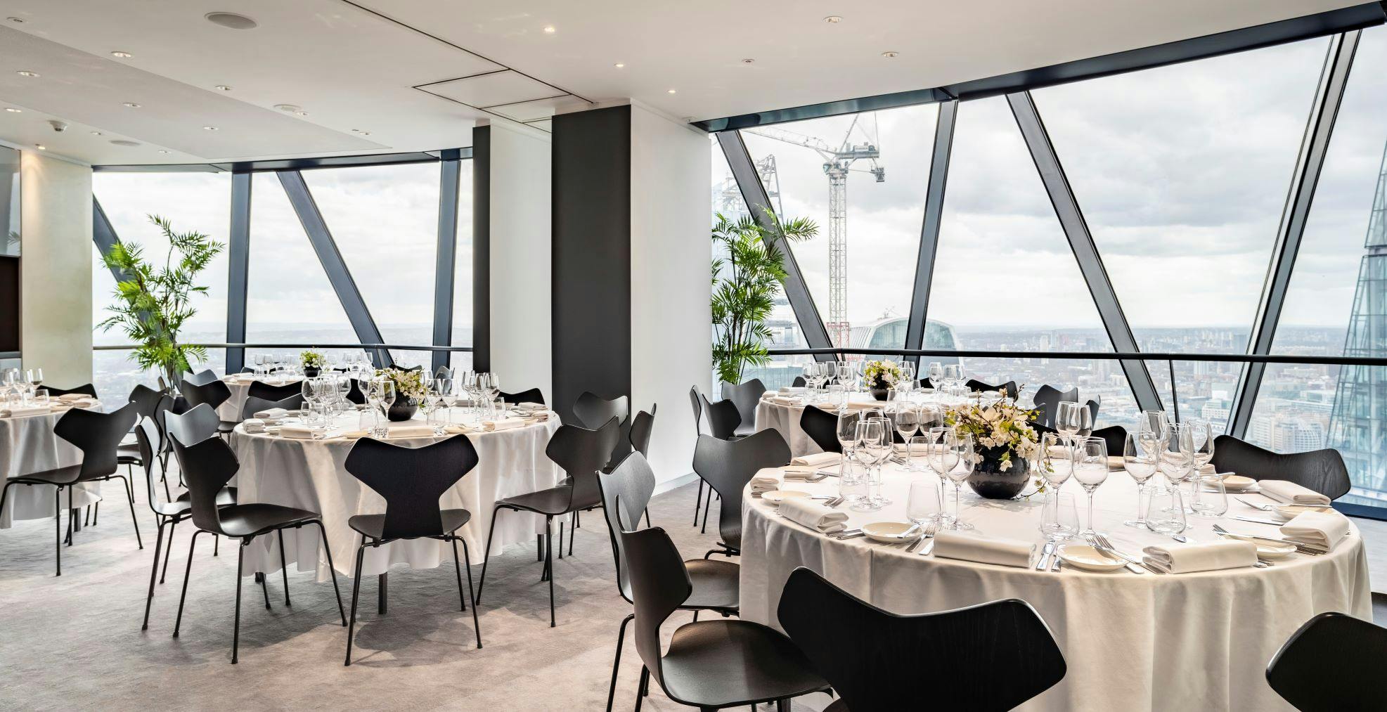 Double private dining rooms at Searcys, elegant tables, ideal for corporate events.