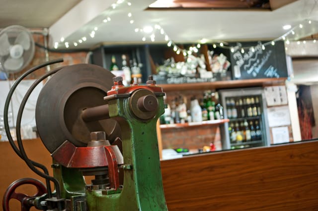 Theatre Bar at St Bride Foundation with vintage machine, ideal for creative events.