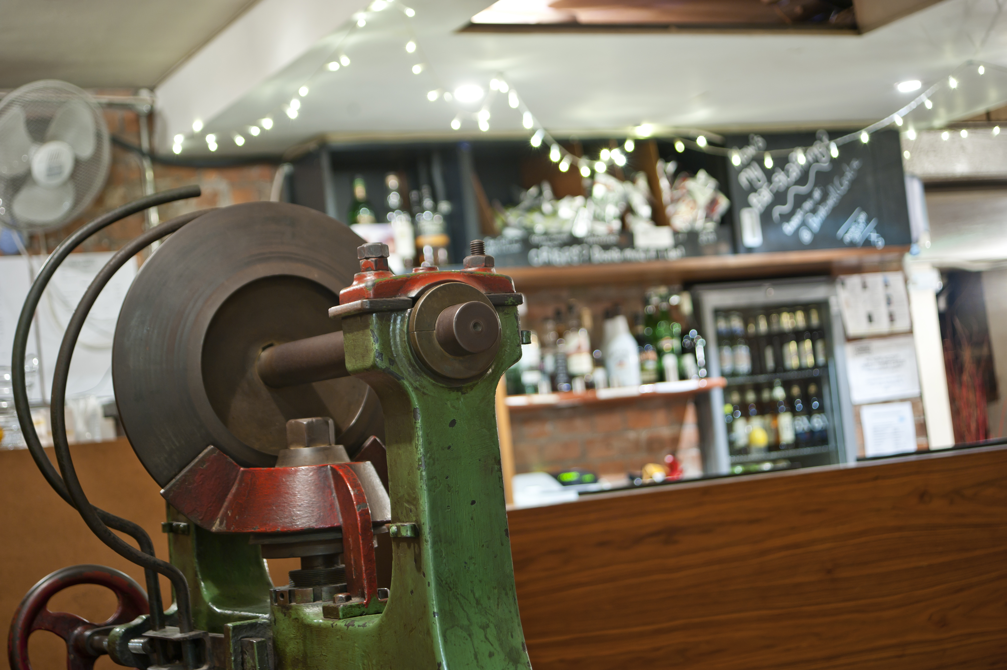 Theatre Bar at St Bride Foundation with vintage machine, ideal for events and gatherings. - Banner