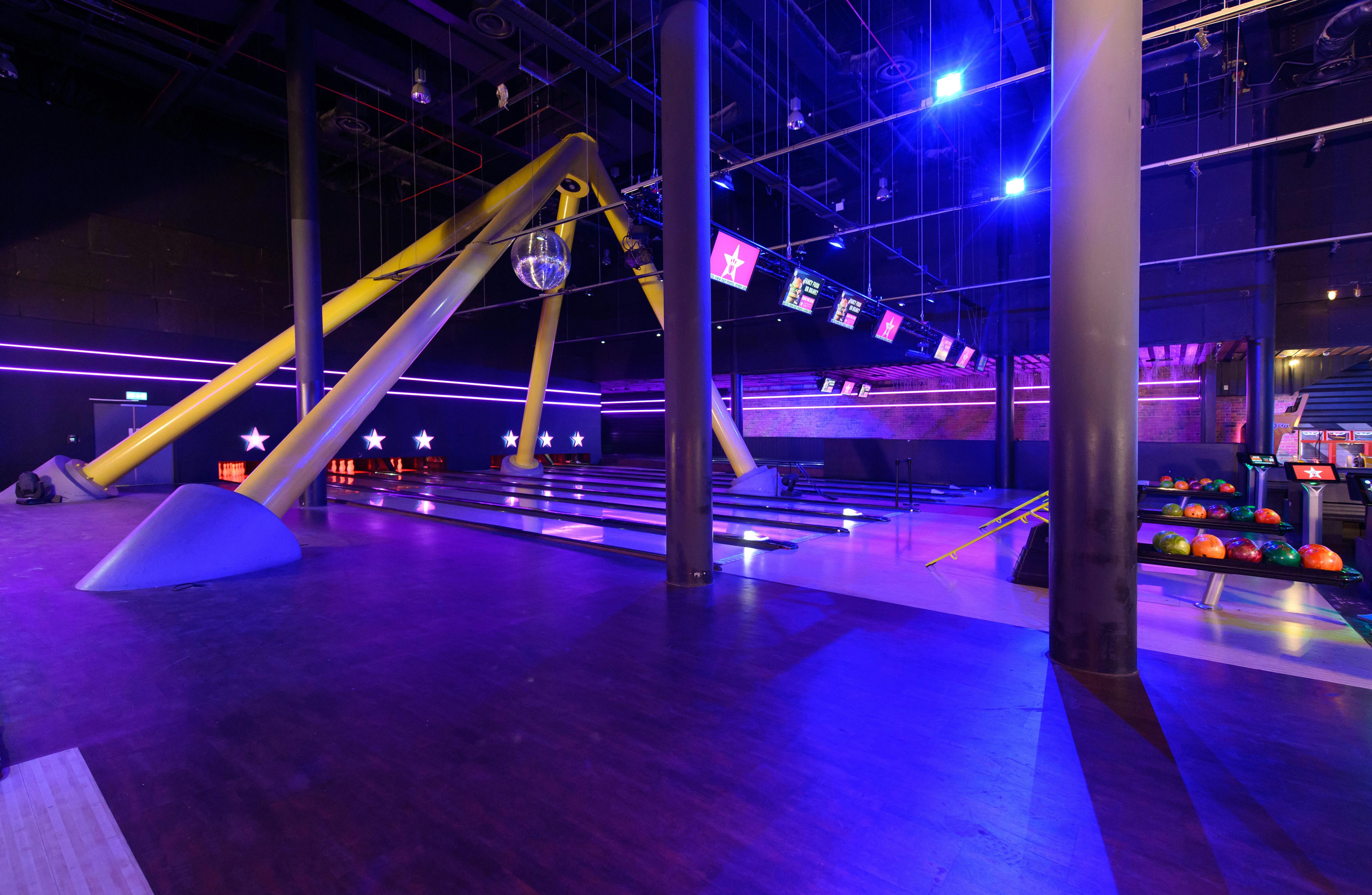 Vibrant event space at Hollywood Bowl London O2 with modern bowling alley for corporate events.