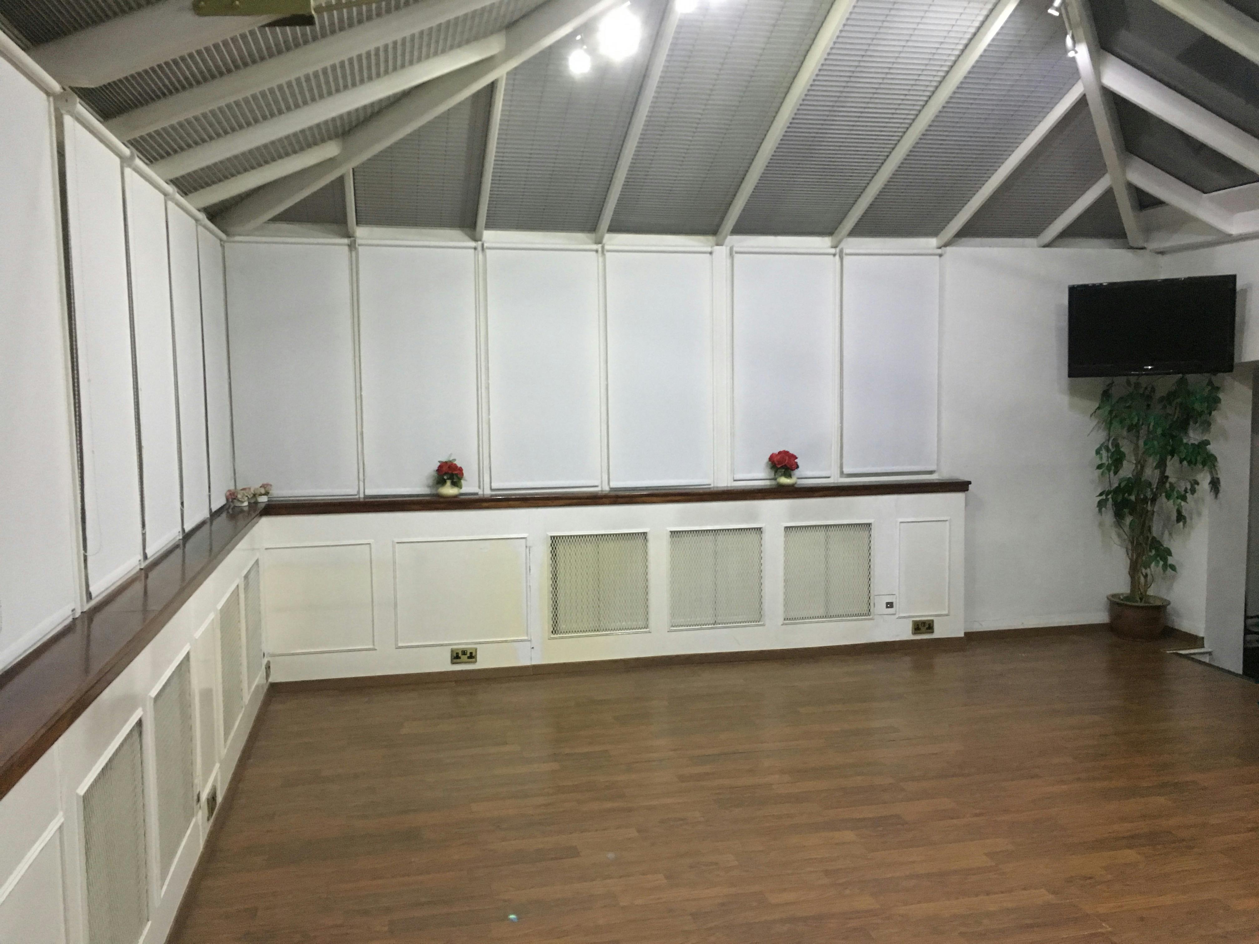 Meeting Room in Space 88 with large windows, ideal for workshops and events.
