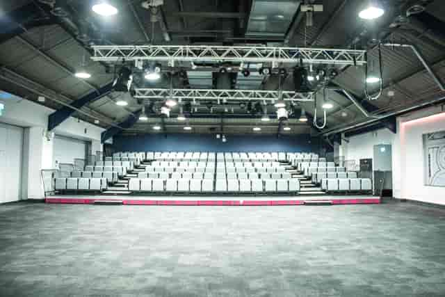 Auditorium with tiered seating, ideal for presentations and performances at Business Design Centre.