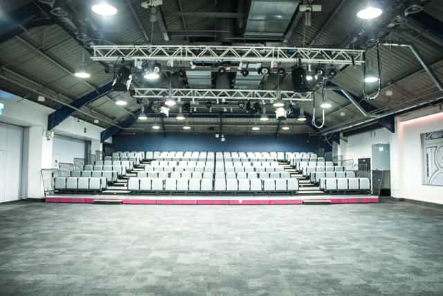 Auditorium with tiered seating, ideal for presentations and performances at Business Design Centre.