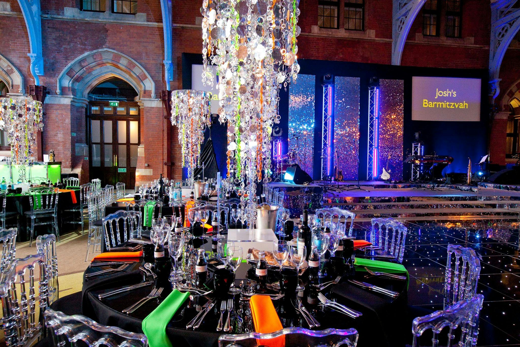 Hansom Hall Bar Mitzvah setup with elegant tables and vibrant decor at St. Pancras Hotel.