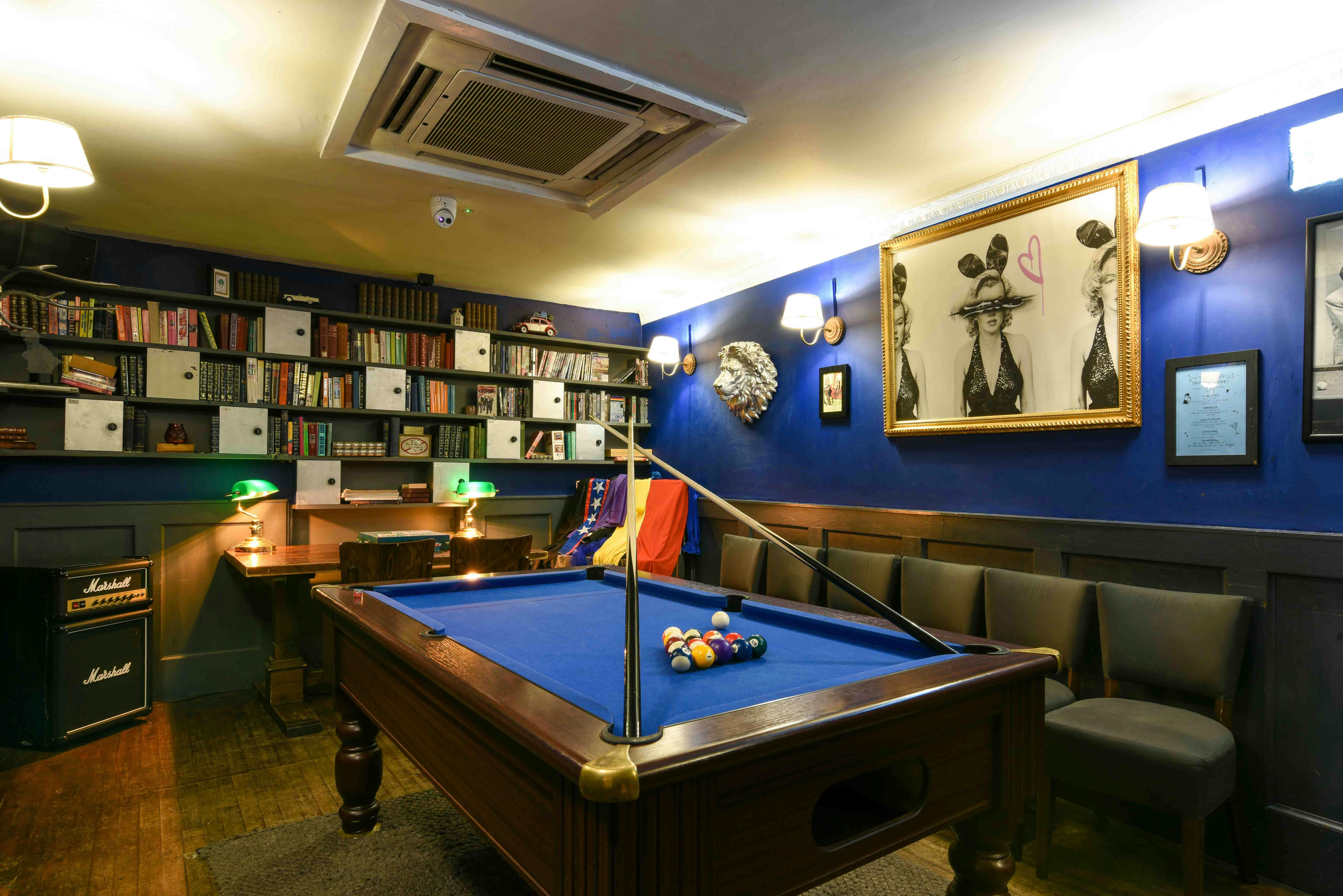 Cozy meeting space with billiards table for team-building and informal gatherings.