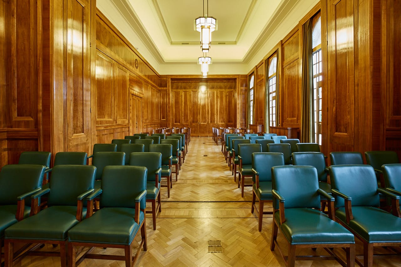 Hackney Town Hall meeting room with green chairs, ideal for conferences and gatherings.