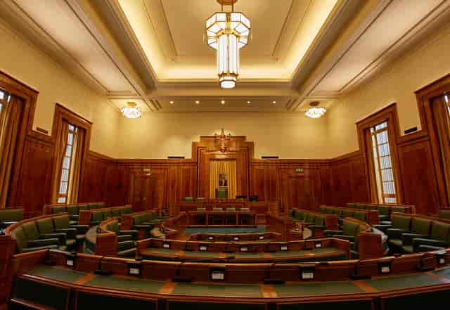Council Chamber in Hackney Town Hall with elegant wood paneling, ideal for conferences.