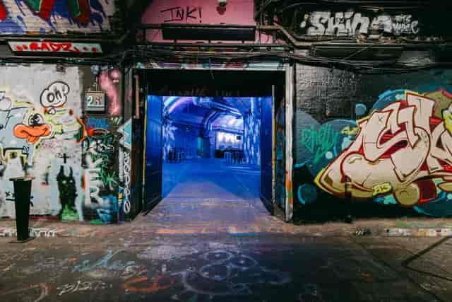 Urban venue with graffiti entrance, ideal for creative events and exhibitions.