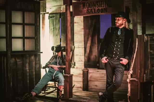 Western-themed Moonshine Saloon immersive cocktail experience for corporate event gala.
