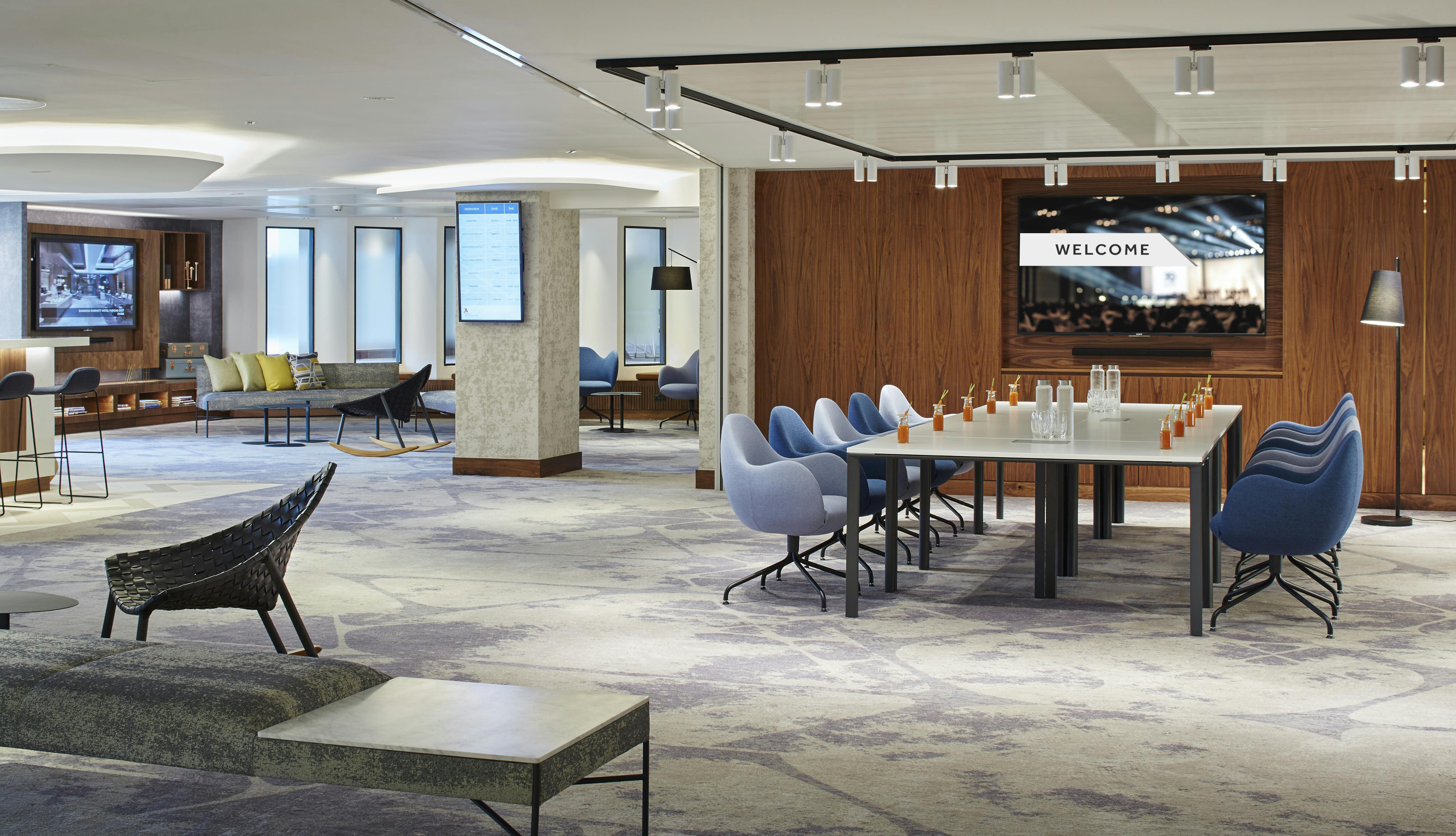 Modern meeting space at London Heathrow Marriott with sleek table setup for events.